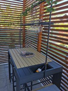 a wooden table with a stand in front of a wall at Ludberga in Ludbreg