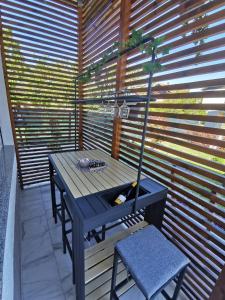 a blue table and a chair on a patio at Ludberga in Ludbreg