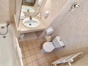 a bathroom with a toilet and a sink and a mirror at Auberge des Salles in Les Salles-sur-Verdon +91 photos