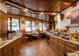 a large kitchen with wooden floors and wooden ceilings at Terano Urban Lodge in Maribor in Maribor