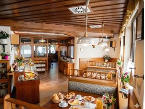 a restaurant with a table with food on it at Terano Urban Lodge in Maribor in Maribor