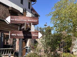 a group of street signs in front of a building at Am kleinen Storchennest in Ummendorf