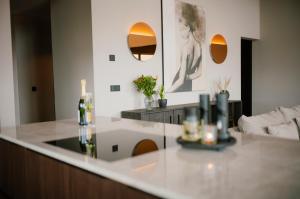 a living room with a counter and a couch at Modern Aurora Retreat in Selfoss +37 photos