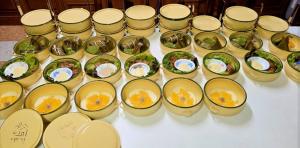 a bunch of cups filled with food on a table at Kiangnapa Cottage in Kanchanaburi City +83 photos
