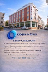a sign for a saturday cosmopolitan hotel in a city at Coskun Otel Şarköy in Şarköy