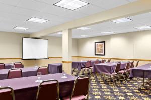 a conference room with tables and chairs and a screen at Comfort Inn Somerset in Somerset +41 photos