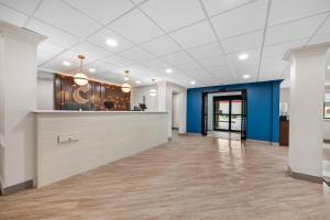 an empty office lobby with a blue and white ceiling at Comfort Inn Pikeville in Pikeville