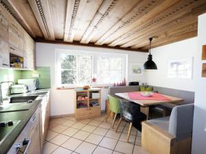 a kitchen with a table and a dining room at Vacation home in Flachau in Flachau