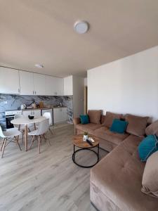 a living room with a couch and a table at AZA holiday in Kotor
