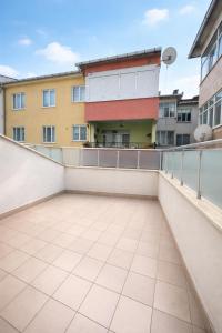 a balcony with a view of a building at Coskun Otel Şarköy in Şarköy