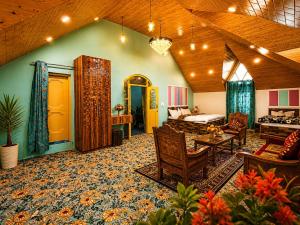 a large living room with a bed and a couch at Water Vibe Homestay Srinagar in Srinagar