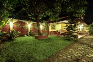 Κήπος έξω από το Griya Langen Guesthouse