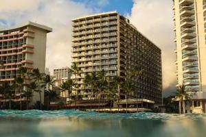 a pool of water in front of two tall buildings at OUTRIGGER Waikiki Beach Resort in Honolulu