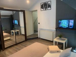 a living room with a flat screen tv and a living room at Villa Rubčić in Rakovica