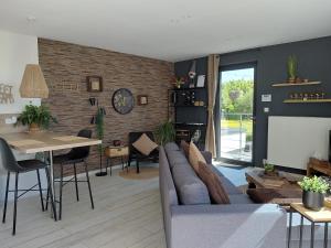 a living room with a couch and a table at Sweet Dreams in Visé