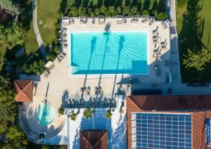 an overhead view of a swimming pool on a building at Ocean Beauty Beachfront Boat House in Portorož with Sea View and Jacuzzi in Portorož +43 photos