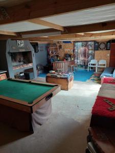 a living room with a pool table in it at Cozy Corner Unit 1 and unit 2 in Bredasdorp
