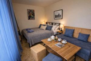 a living room with a bed and a table at TEVRA Nature, Retreat Mountain Cabins Above the City Ijevan, Dilijan in Ijevan