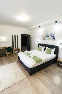 a bedroom with a large bed in a room at Vila Diamond Lux&Spa in Sovata +134 photos