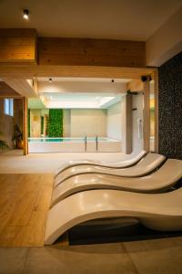 a lobby with a row of escalators in a building at Aparthotel Diamond SPA Relax in Białka Tatrzańska