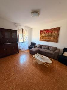 a living room with a couch and a table at Casa di Mary in Pontremoli