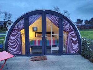 a bedroom in a dome tent with a bed inside at Canal Stay in Cloondara