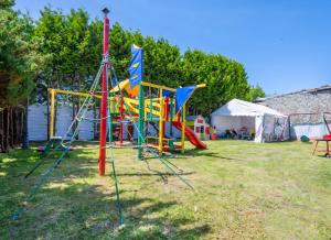 a group of playground equipment in a yard at Domki Maks in Bobolin