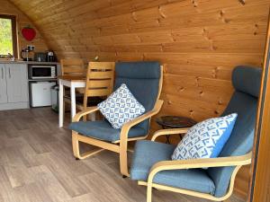 a room with two chairs and a table at Kingsford Pod in Wexford