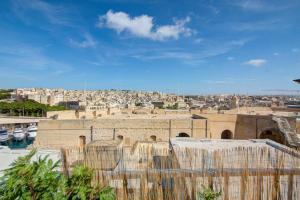 a view of a city from the roof of a building at The Oasis - R4 in Senglea +25 photos