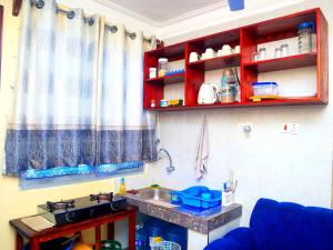 a kitchen with a sink and a counter top at Dorado Homestay, Chaani in Mombasa