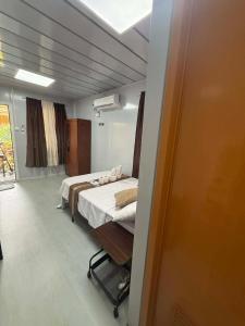a bedroom with two beds in a room at Crespina Private House in General Luna