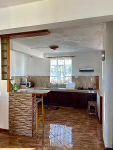 a kitchen with a island in the middle of a room at Shalom Villa 2 in Vacoas