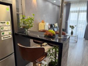 a kitchen with a counter with some fruit on it at Sun's house in Phan Rang–Tháp Chàm +9 photos