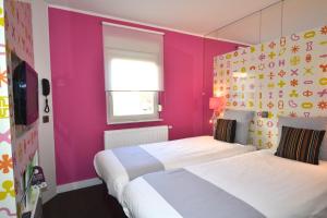 Ein Bett oder Betten in einem Zimmer der Unterkunft Ibis Styles La Louvière