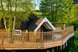 a wooden deck with a house on it at 2 - Luxury Escape - Outdoor bathtub and sauna under the stars! in Pont Sticill
