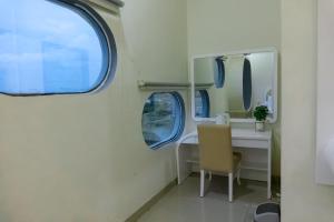 a bathroom with a sink and a mirror at Saung Komando Ciwidey in Winducina +34 photos