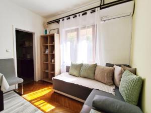 a living room with a couch and a window at Lana 38 in Savina
