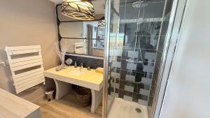 a bathroom with a sink and a shower at Les Pins Perdus in Saint-Ciers-dʼAbzac +30 photos