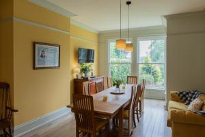 a kitchen and dining room with a table and chairs at The Clarence in Bishop Auckland