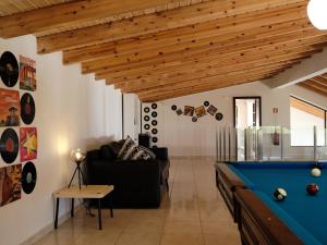 a living room with a pool table at Casa Da Liberdade in Alte