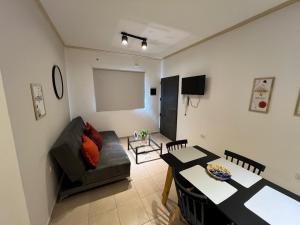 a living room with a couch and a table at Alojamiento Guemes II in San Fernando del Valle de Catamarca