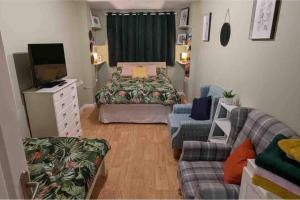 a living room with a bed and a couch at Lovely Comfortable Available in Hereford in Hereford