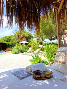 a table with two bowls of fruit on a beach at B&B Villa Pinos Málaga in Alhaurín de la Torre