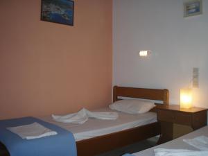 Posteľ alebo postele v izbe v ubytovaní Eros-Iros Portside Stays Skiathos