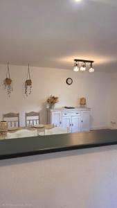 a living room with a kitchen and a dining room at Ferienhäuschen Brohlbachtal in Gamlen