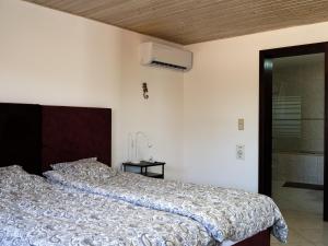 a bedroom with a bed and a walk in shower at Casa Da Liberdade in Alte +37 photos
