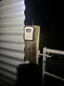 a cell phone sitting on top of a wooden post at Cabin on the Moors in Llansannan