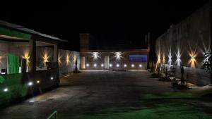 an empty building at night with lights on it at Hotel Club Resort Místico in Coroaci