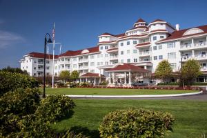 a large white apartment building with red roofs at Inn at Bay Harbor in Petoskey