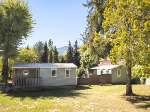 a tiny house with a solar roof on a yard at Camping 3* Les Templiers in Roquebillière